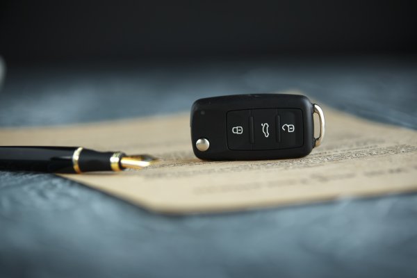 bumper to bumper warranty service car warranty car key pen on paper contract
